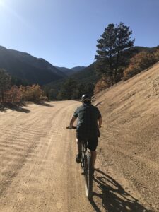 bike rider on dirt road in canyon